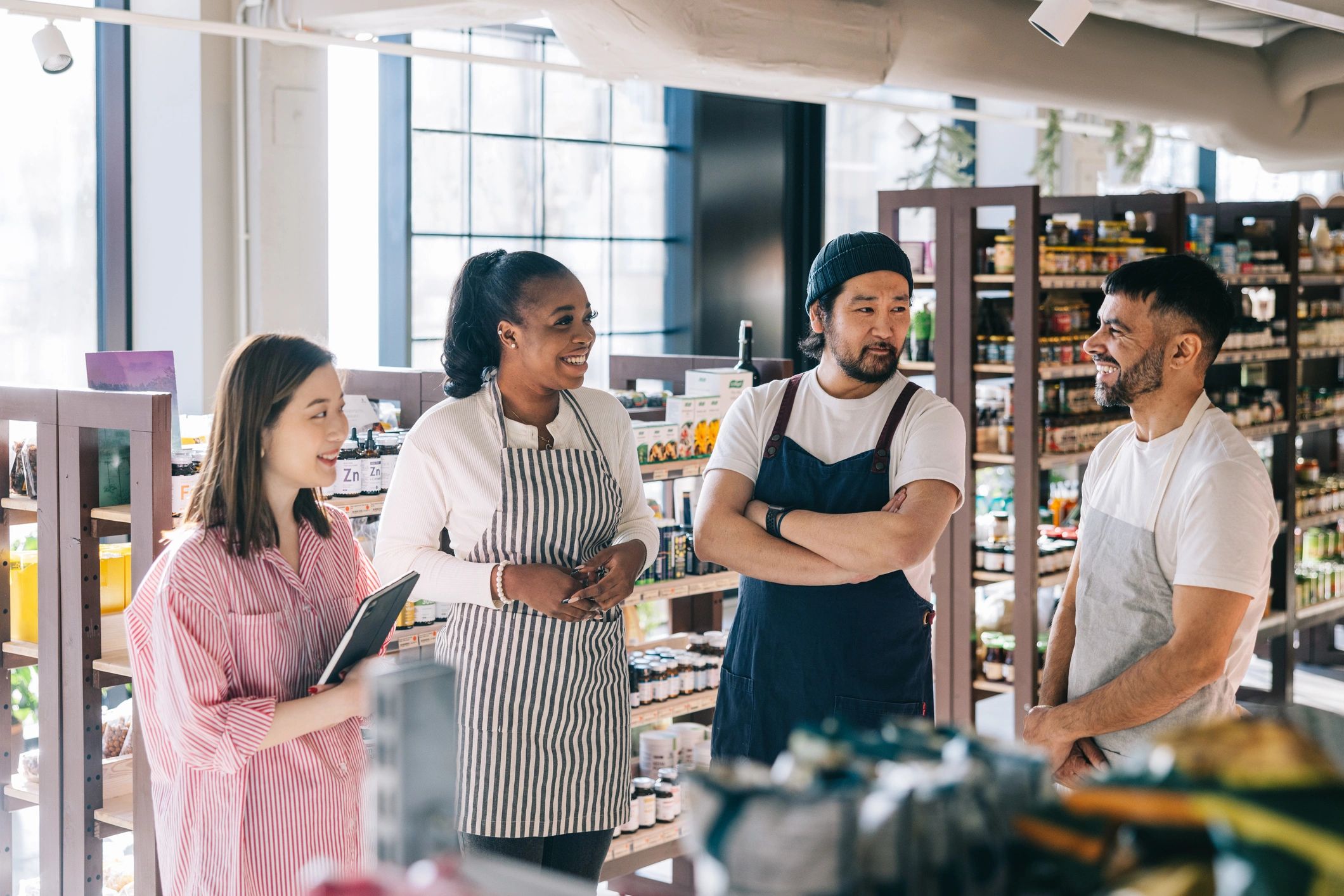 Store manager meeting with employees