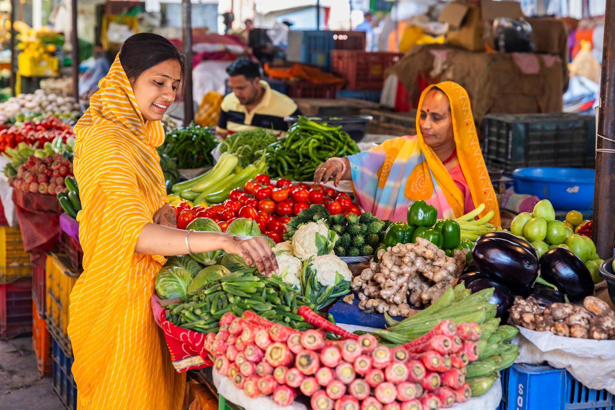 Fresh vegetables at a busy Indian market stall
